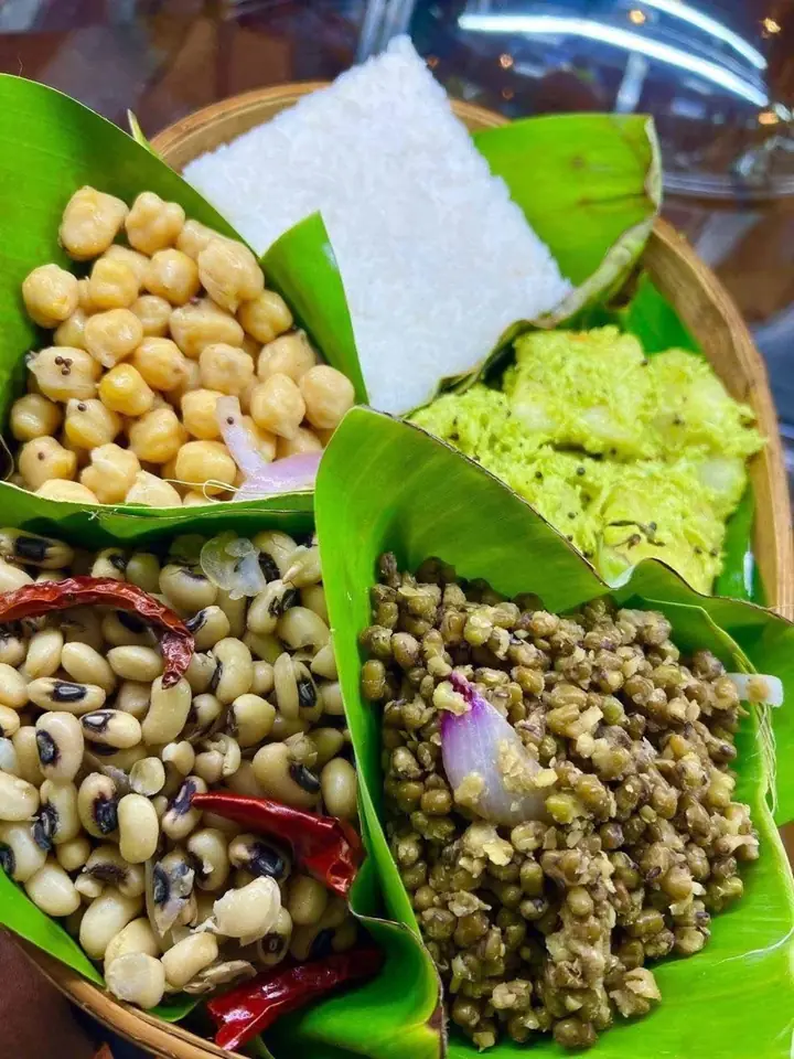 A Sri Lankan breakfast selection with pulses and accompaniments
