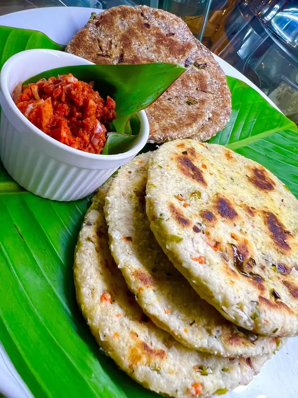 Golden pol roti served with spicy sambol